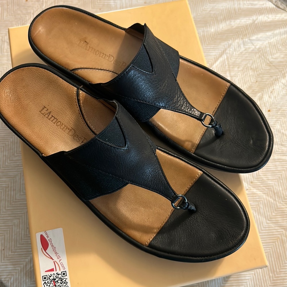 Size 10 fully leather black thong sandal made by L’amour des Pieds.